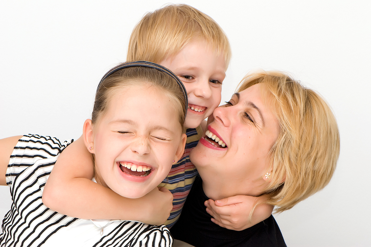 Стоковое фото мама с сыном. A cheerful Family of a son, mother and sister!. Your daughters son